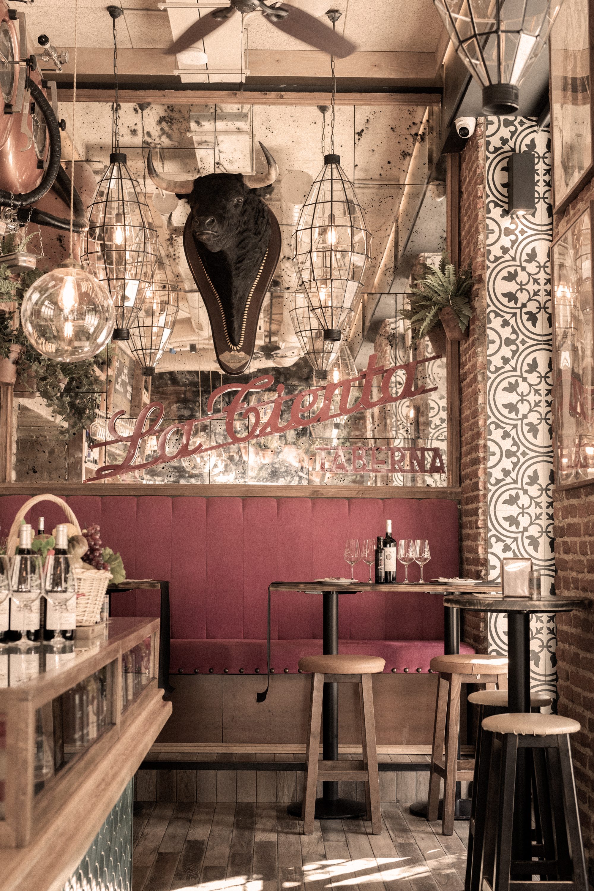 a restaurant with a bull head from the ceiling
