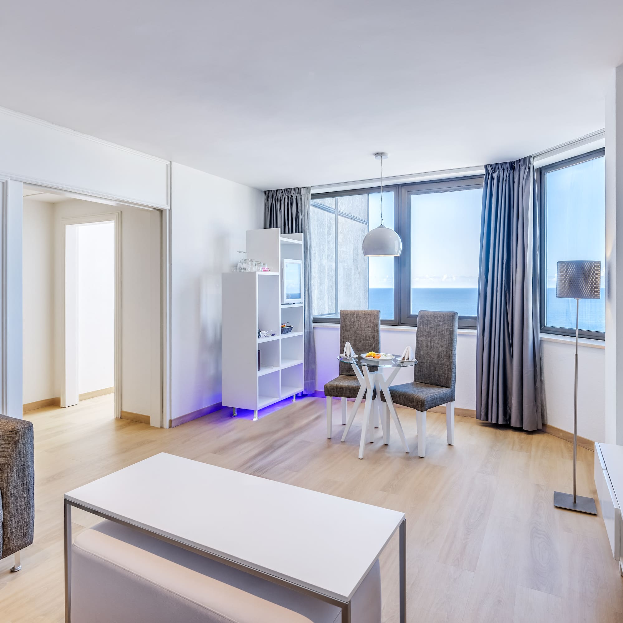 a room with a table and chairs