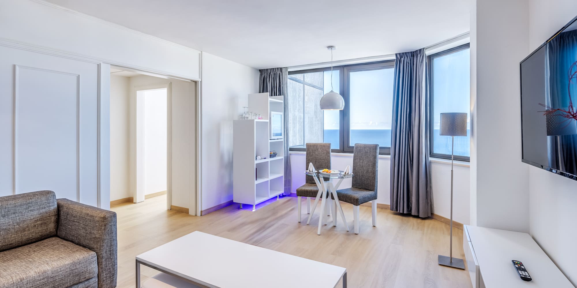 a room with a table and chairs