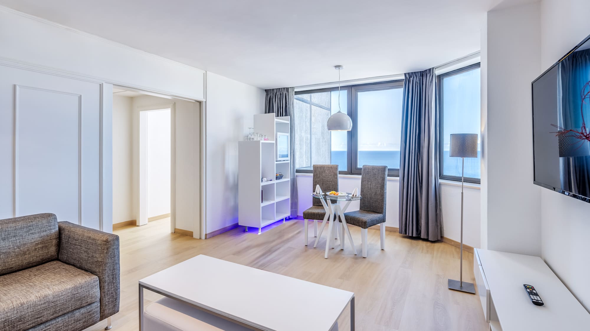 a room with a table and chairs