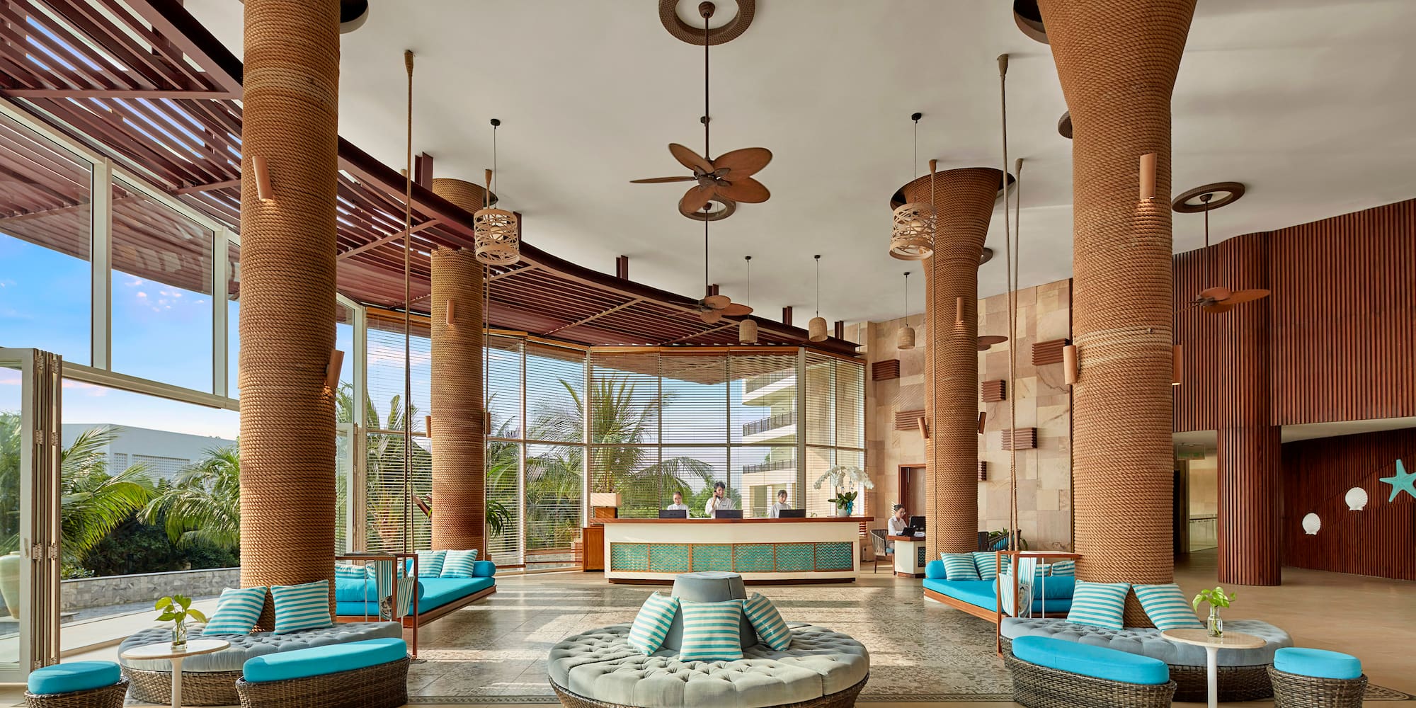 a lobby with blue and white pillows