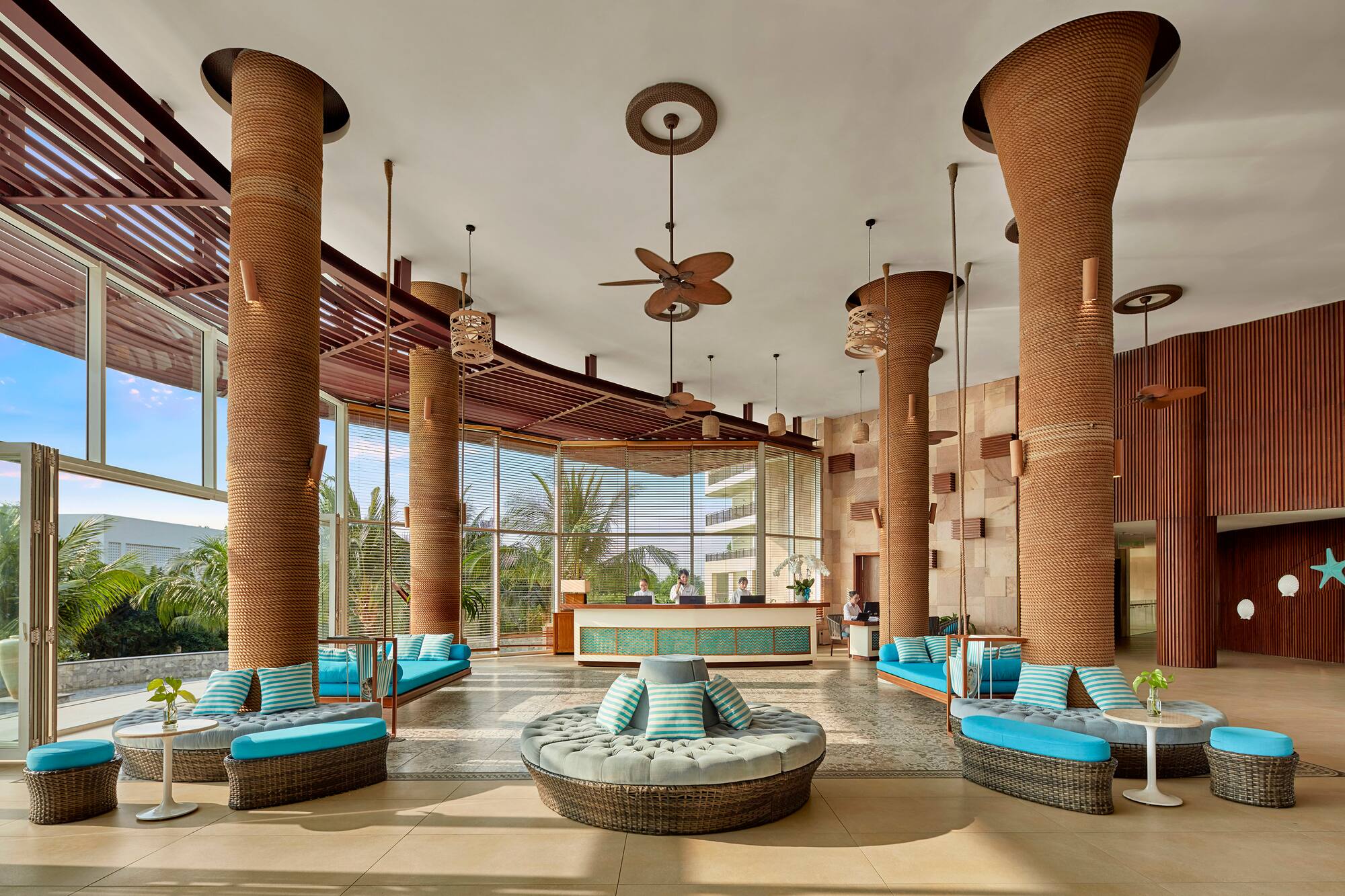 a lobby with blue and white pillows