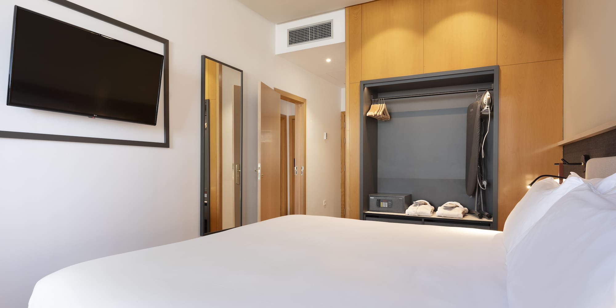 a room with a bed and a tv