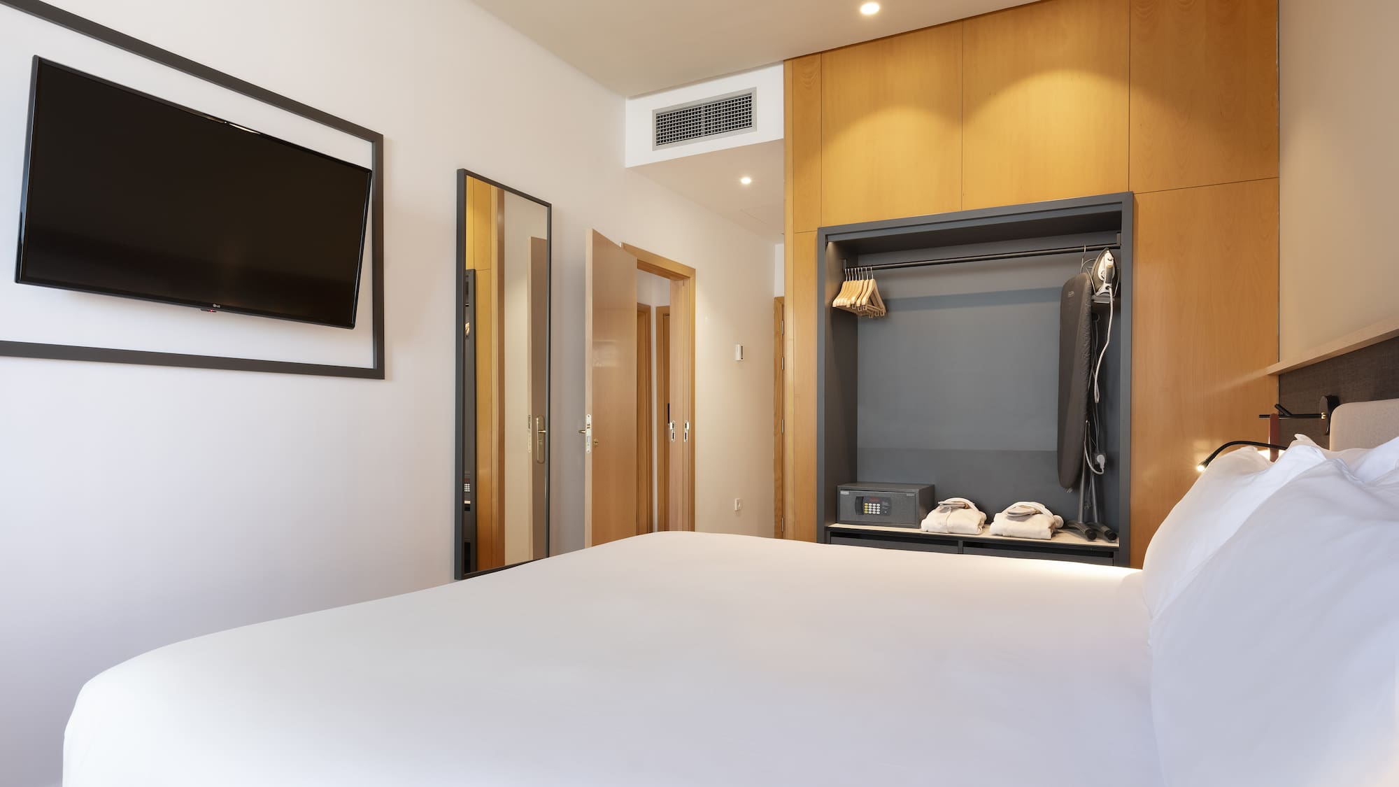 a room with a bed and a tv