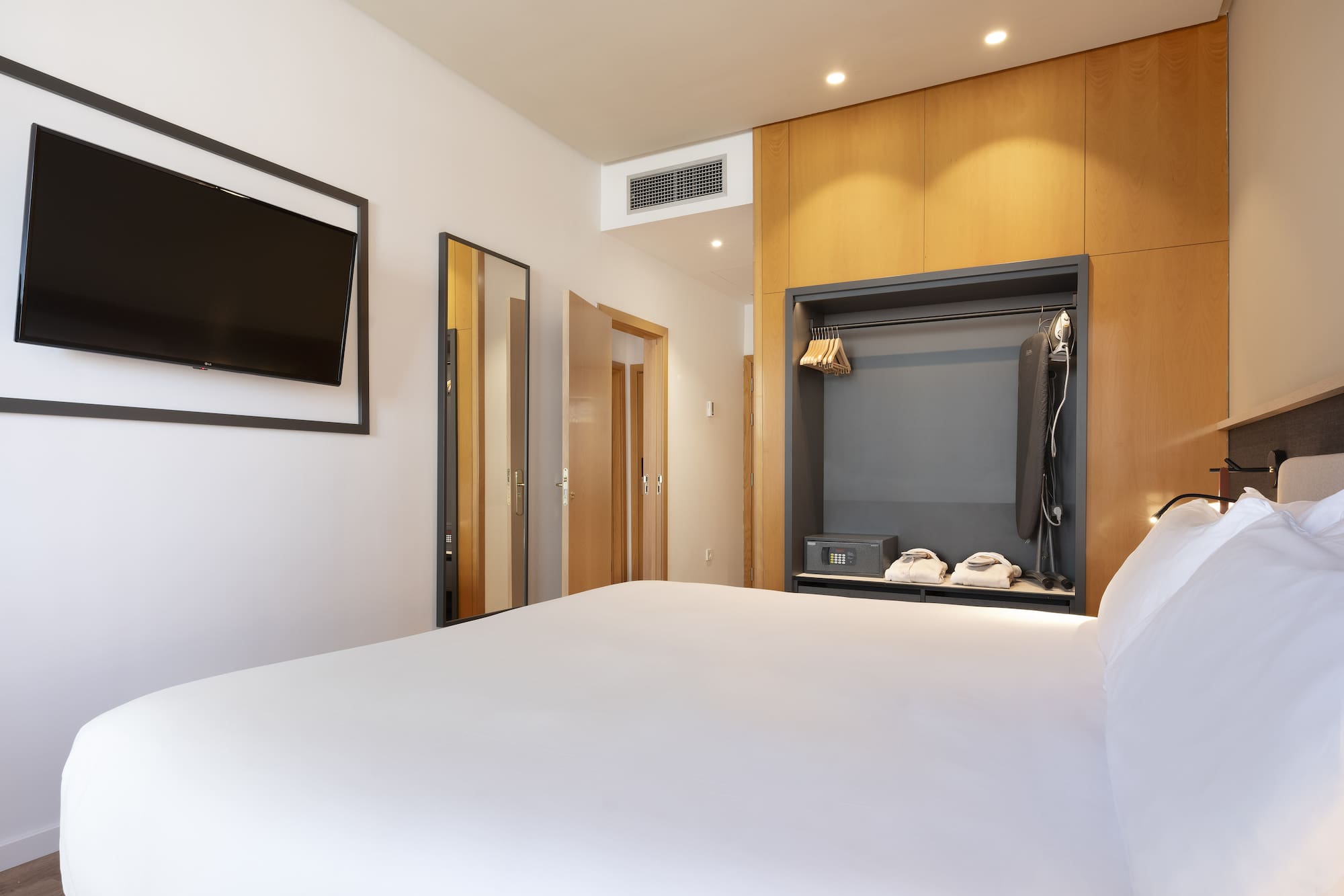 a room with a bed and a tv