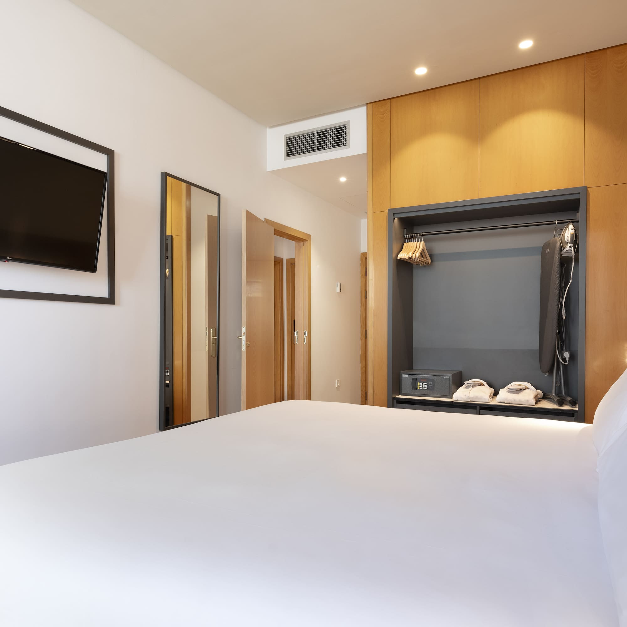 a room with a bed and a tv