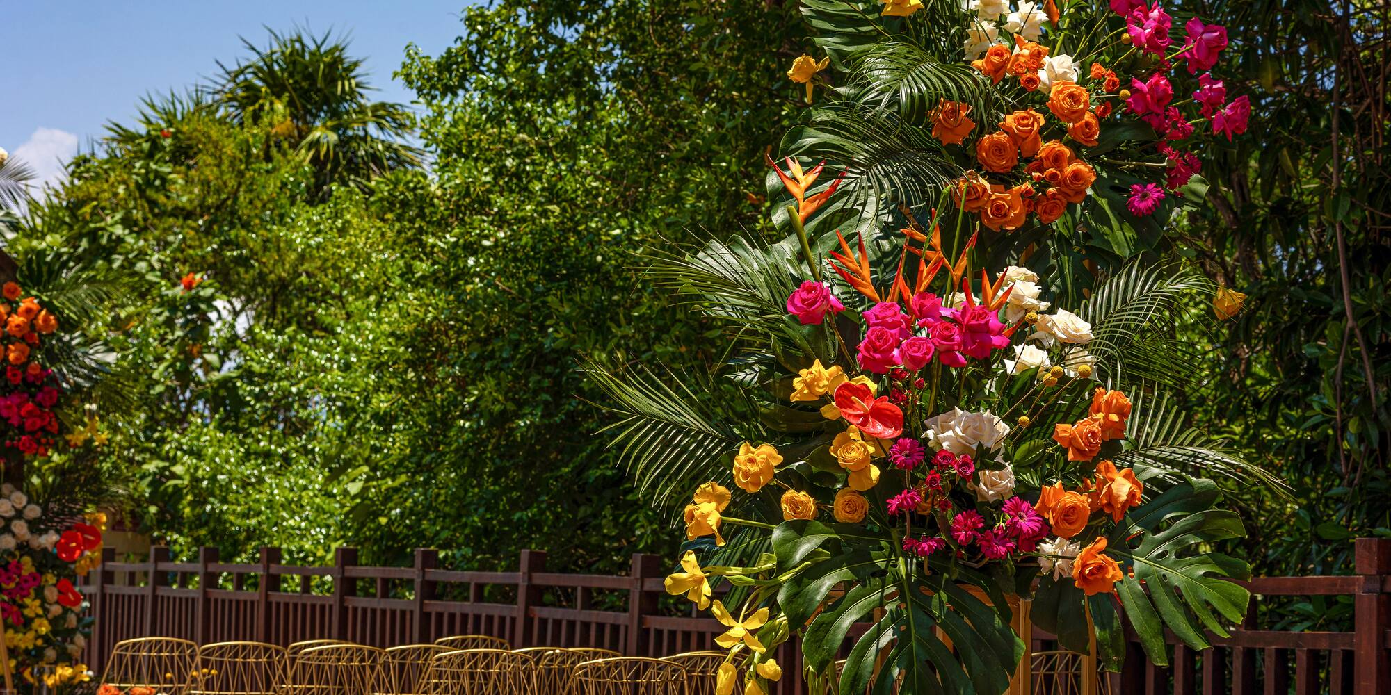 a group of chairs and flowers