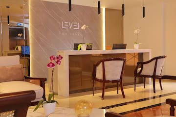 a lobby with chairs and a reception desk
