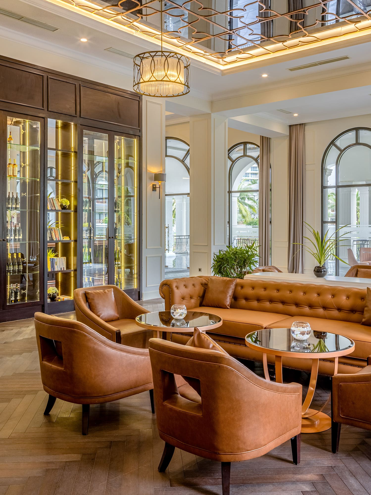 a room with a couch and chairs