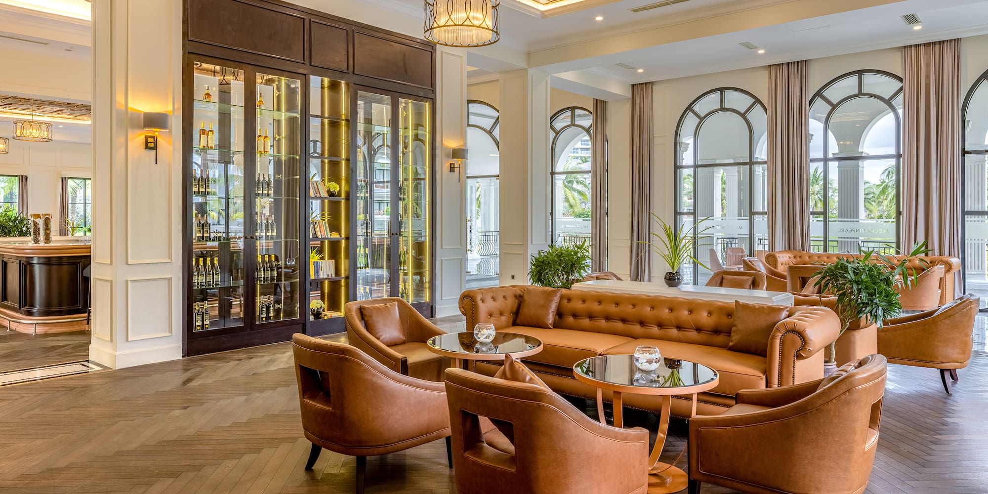 a room with a couch and chairs