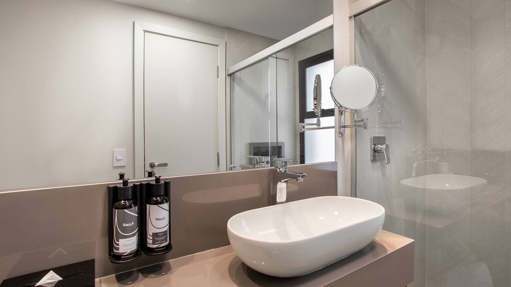 a bathroom with a sink and shower