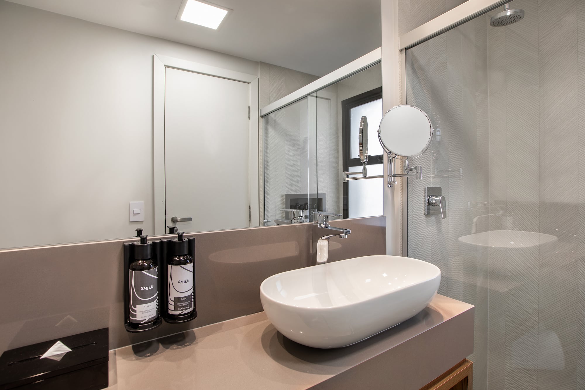 a bathroom with a sink and shower