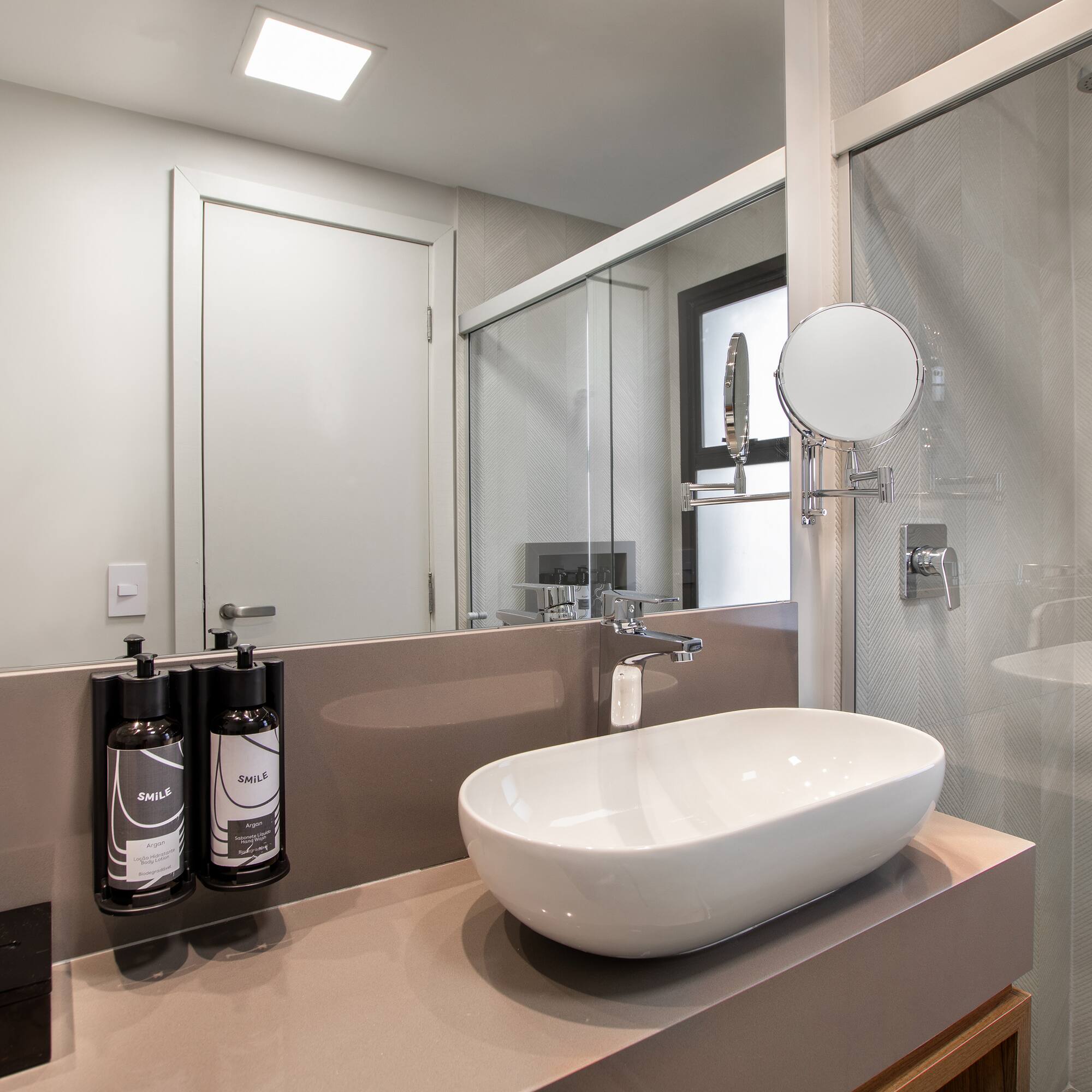 a bathroom with a sink and shower
