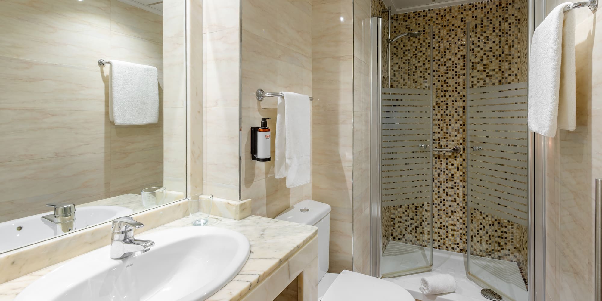 a bathroom with a shower and sink