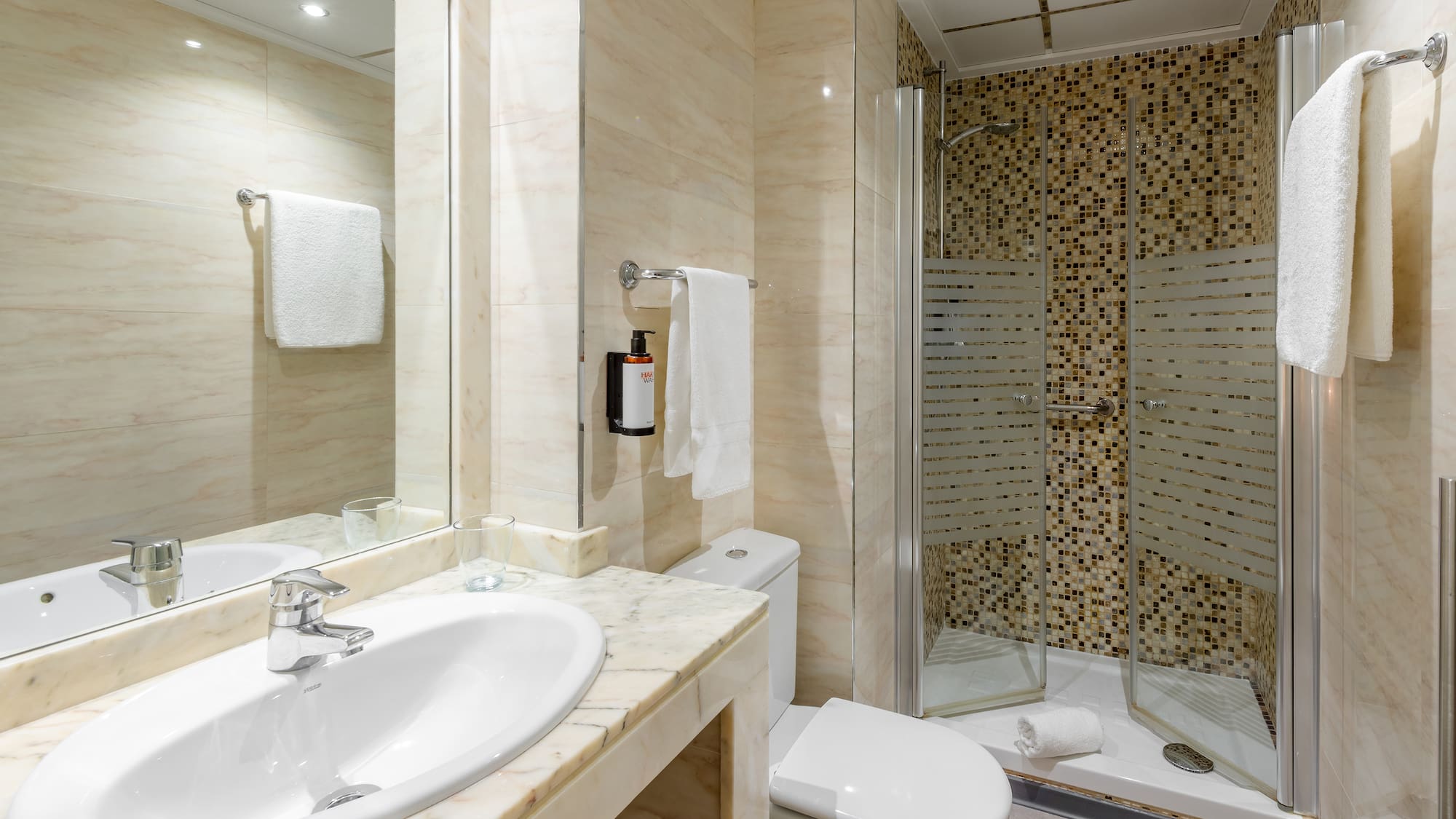 a bathroom with a shower and sink