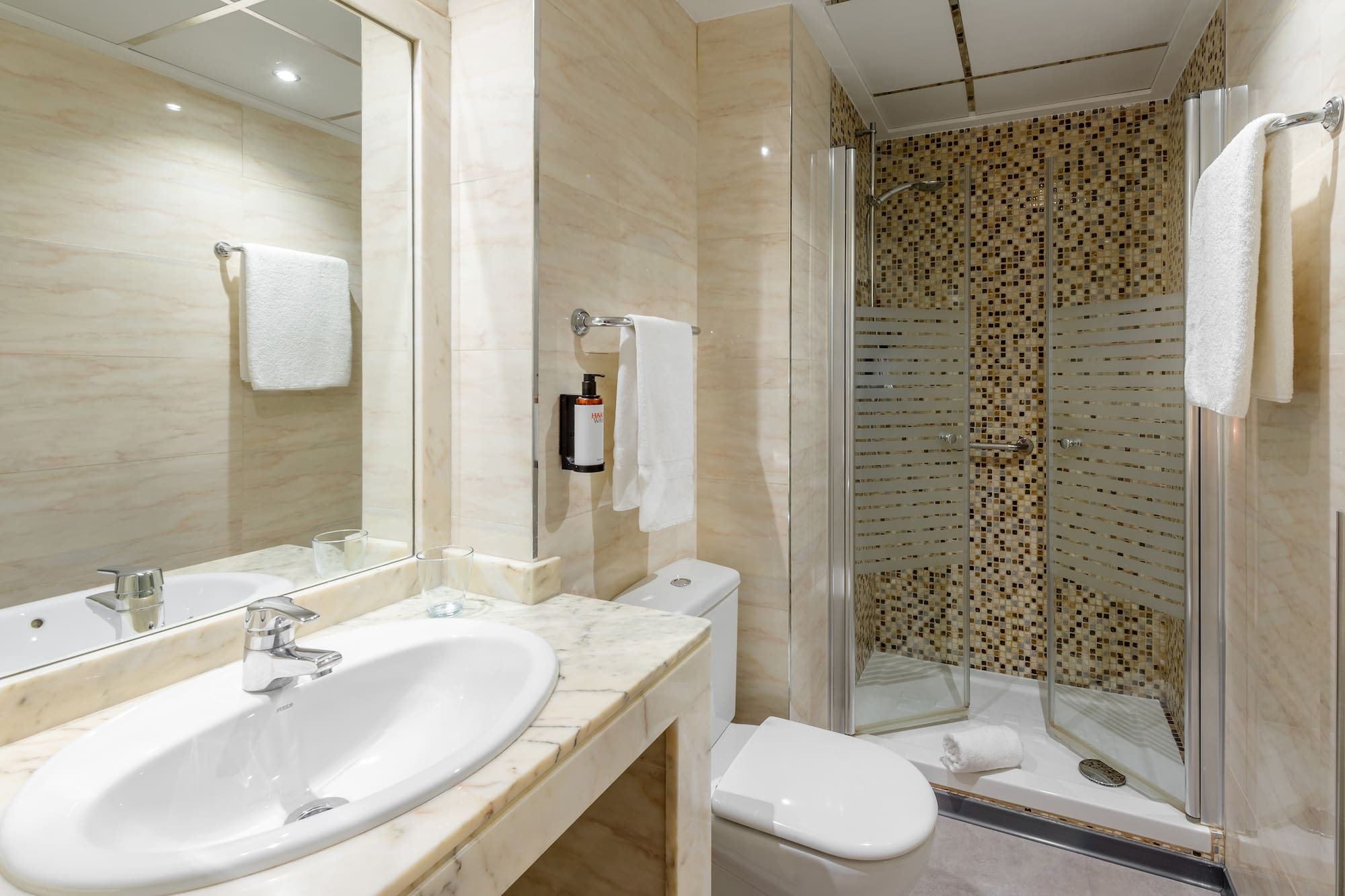 a bathroom with a shower and sink