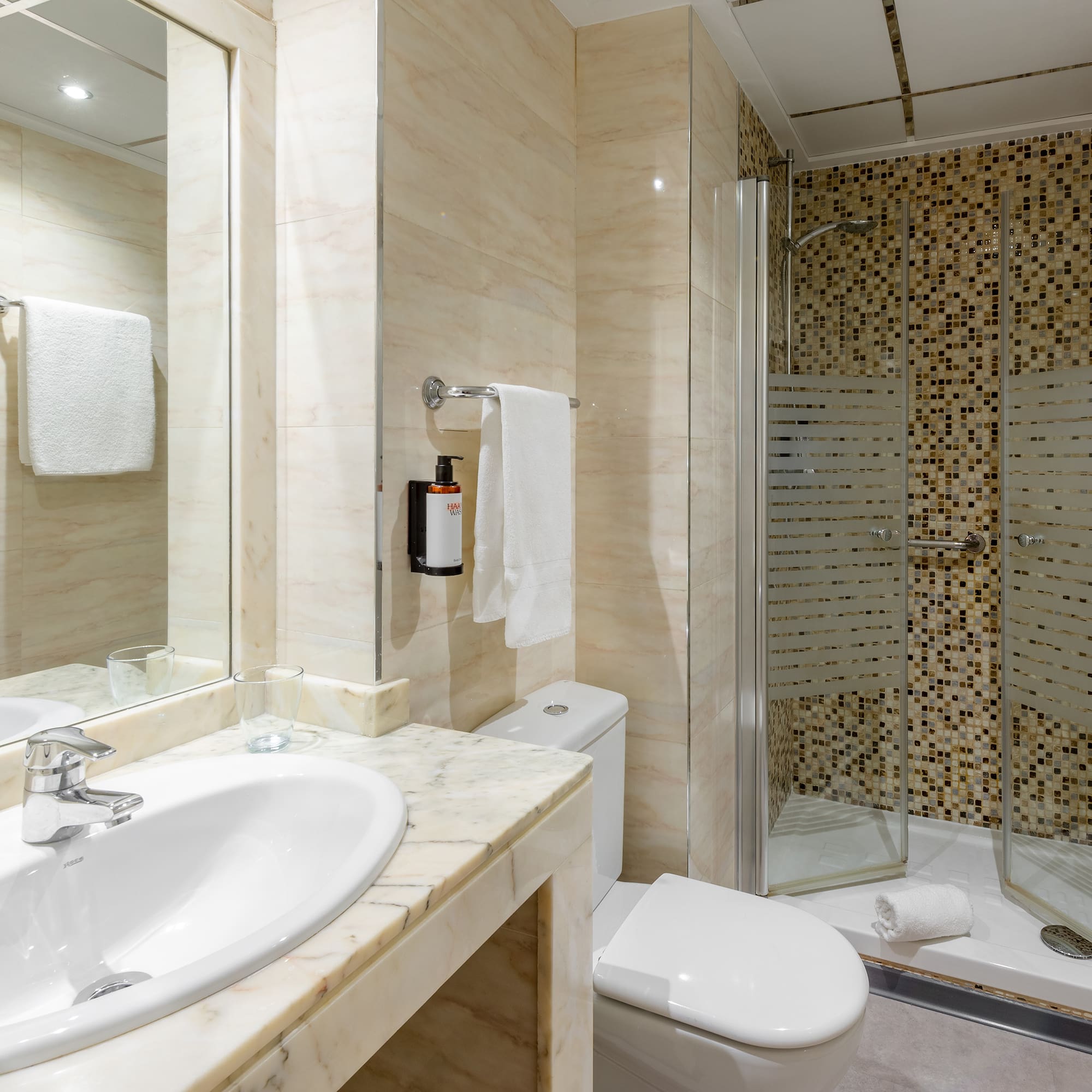 a bathroom with a shower and sink