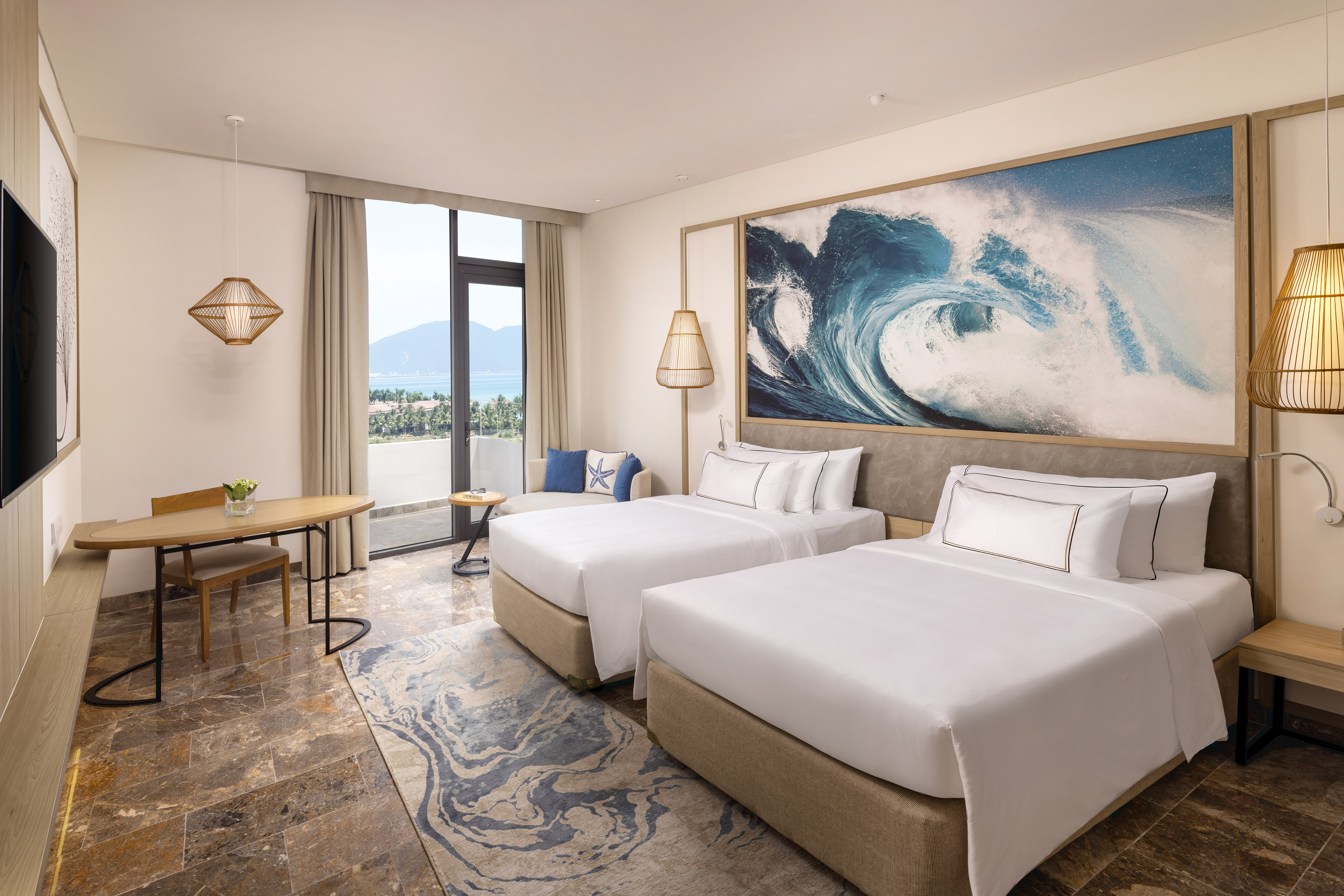 a room with two beds and a table