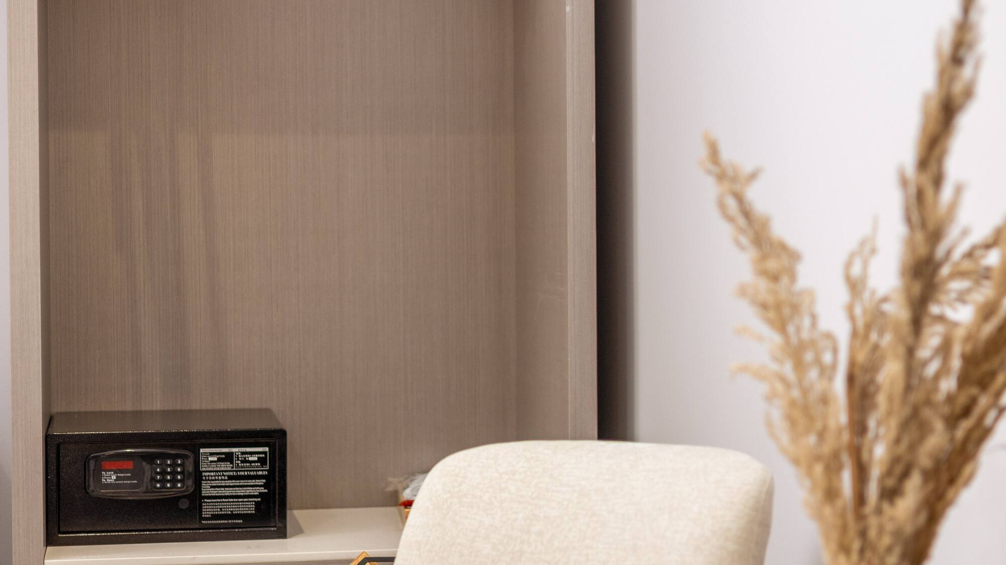 a room with a small closet and a microwave