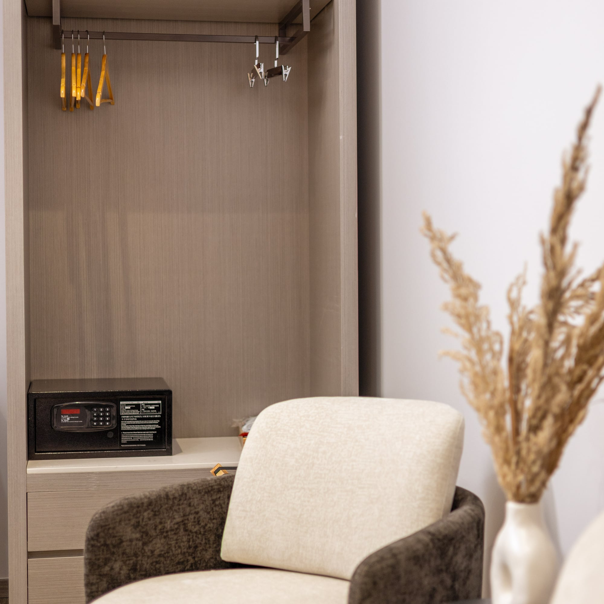 a room with a small closet and a microwave