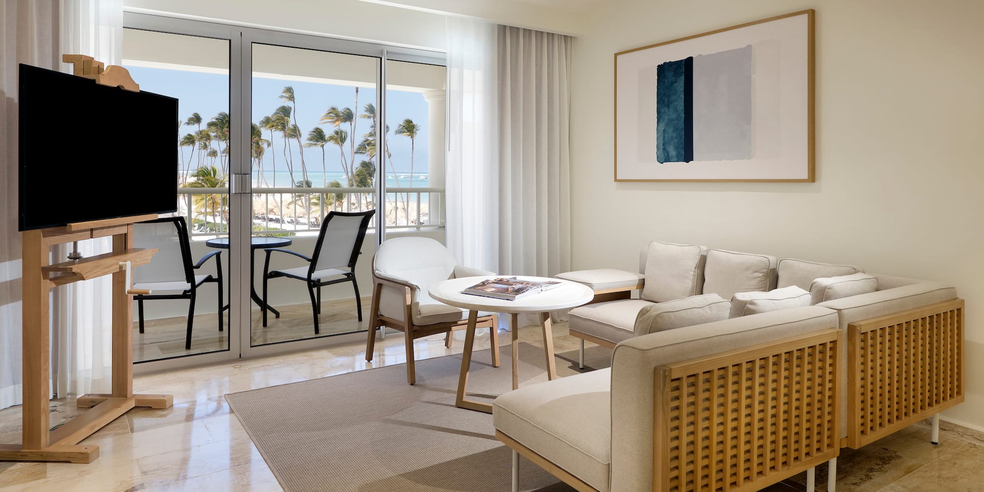 a living room with a television and a table