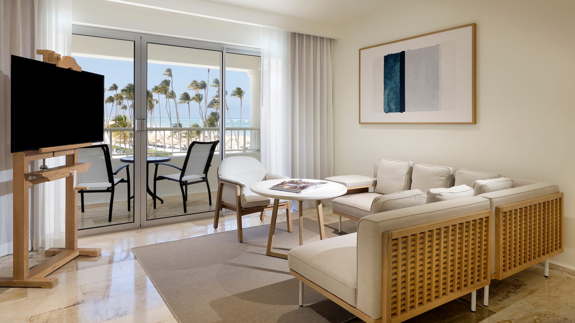 a living room with a television and a table