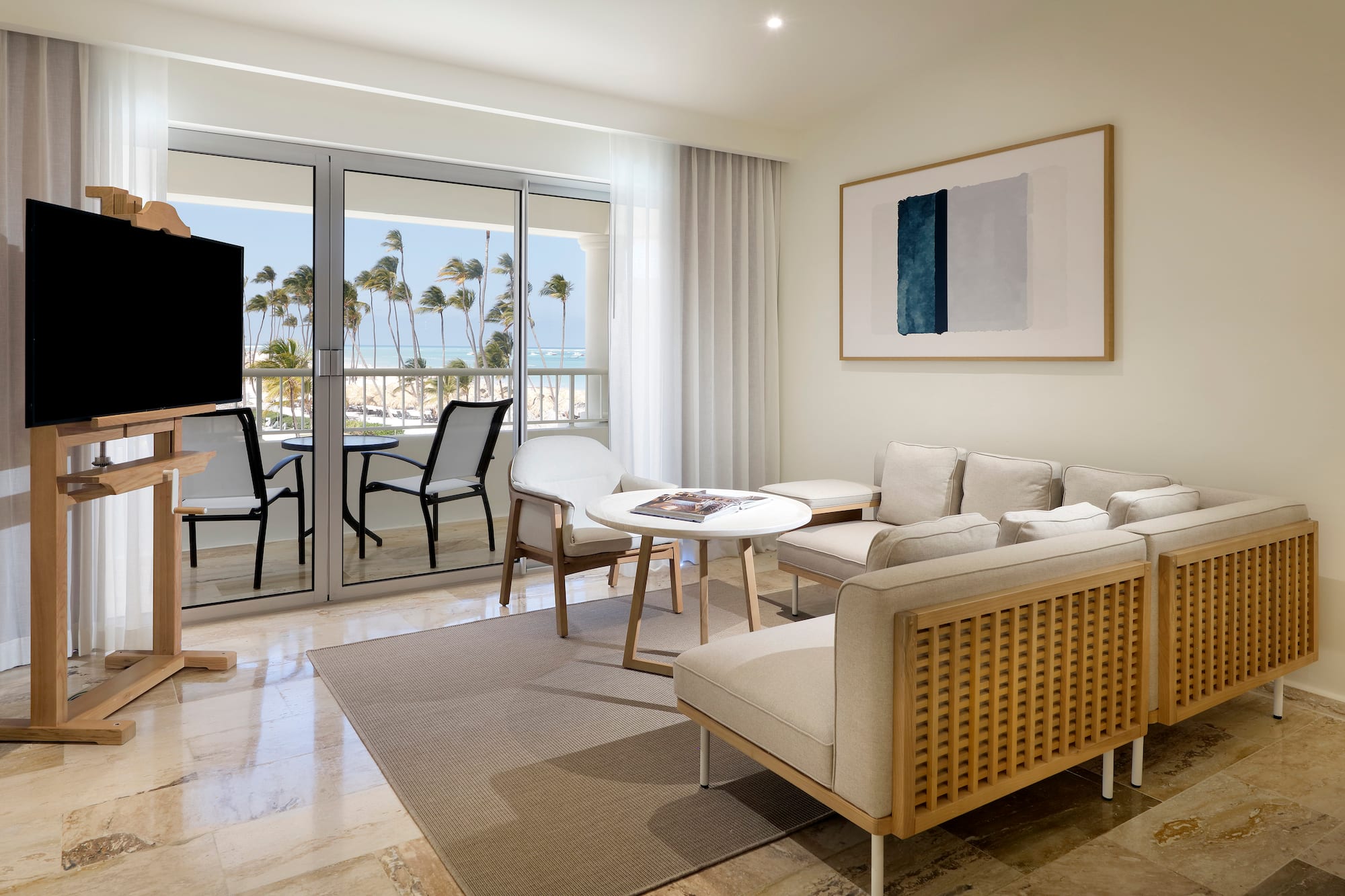 a living room with a television and a table