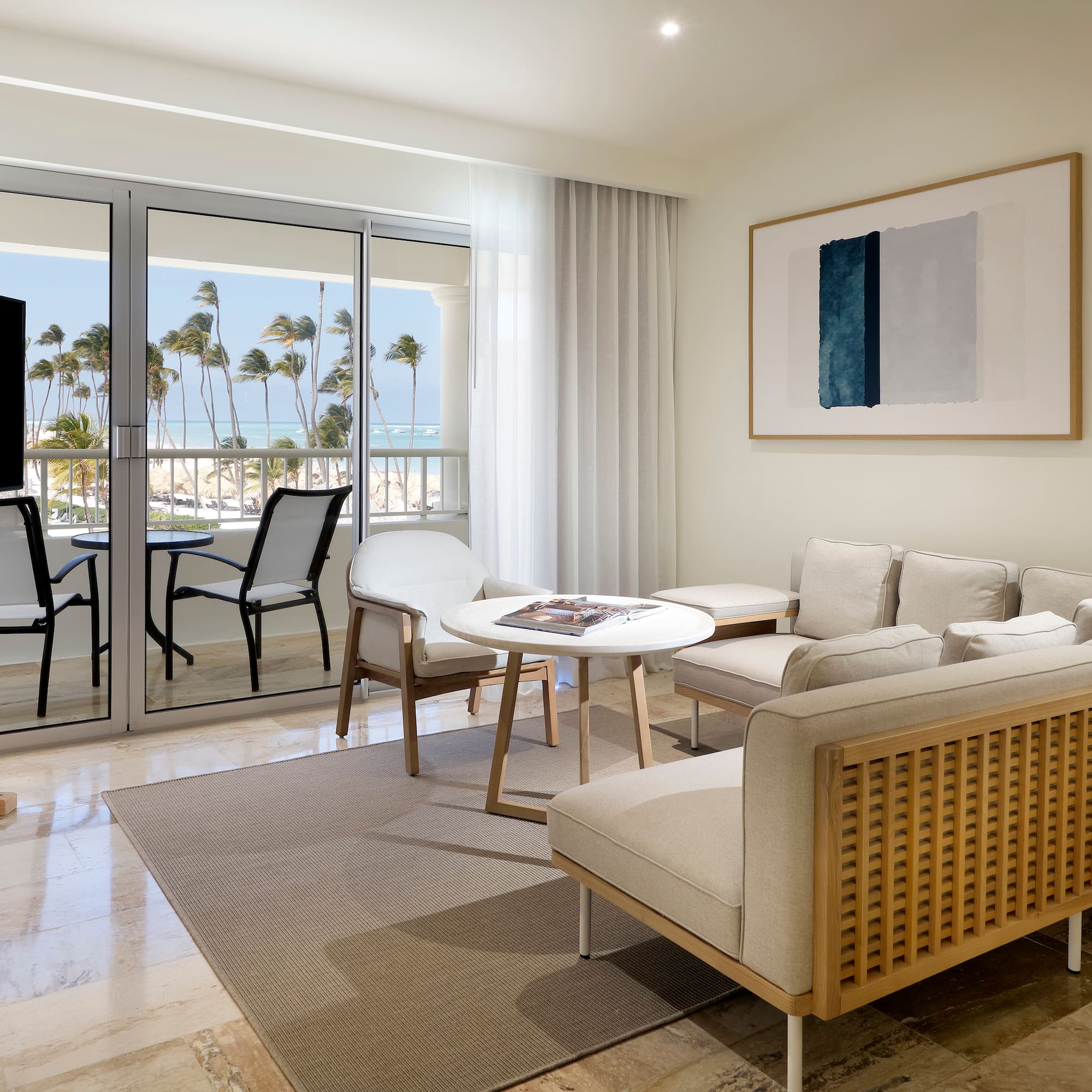 a living room with a television and a table