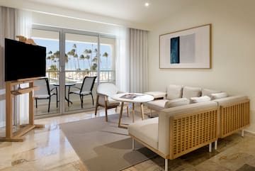 a living room with a television and a table