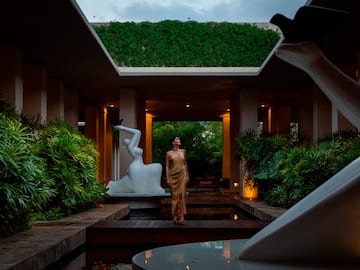 a woman standing in a courtyard