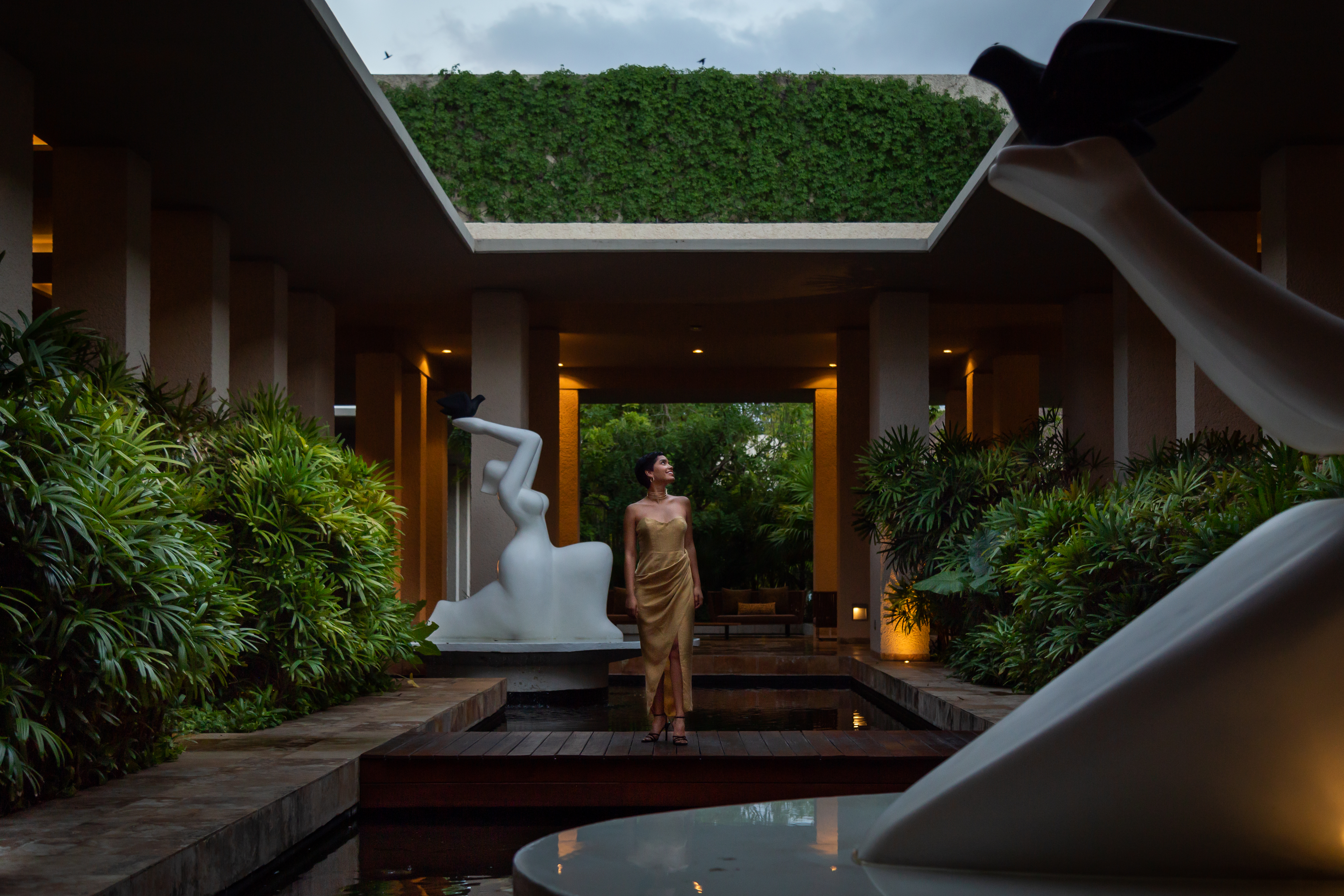 a woman standing in a courtyard