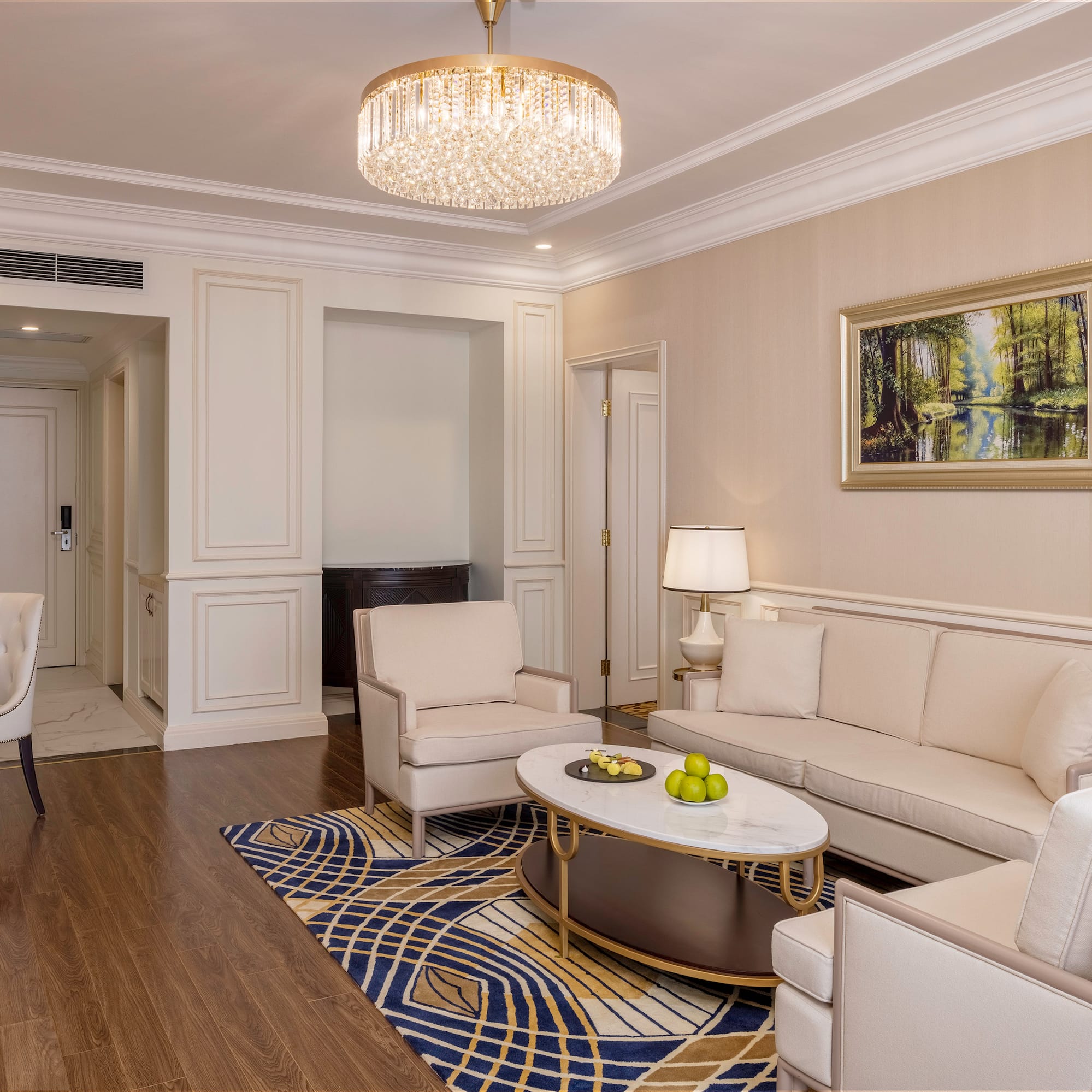 a living room with a chandelier and couches