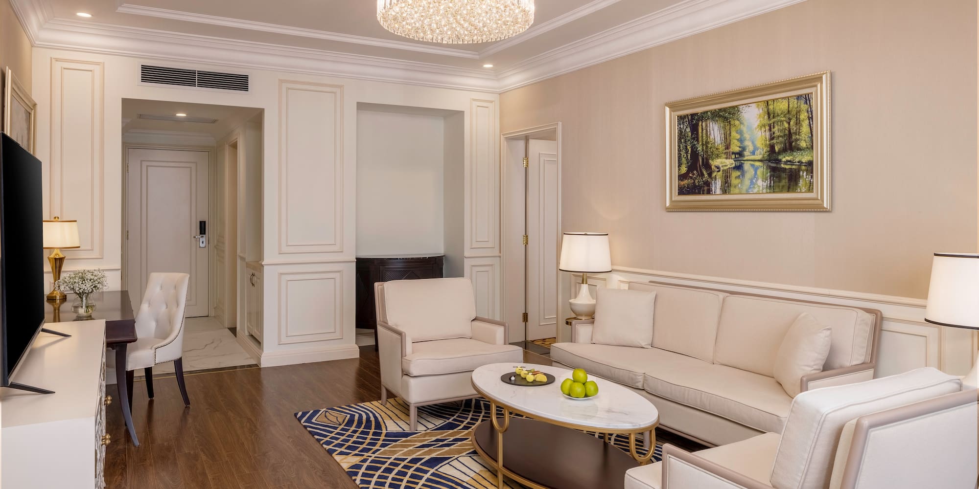 a living room with a chandelier and couches