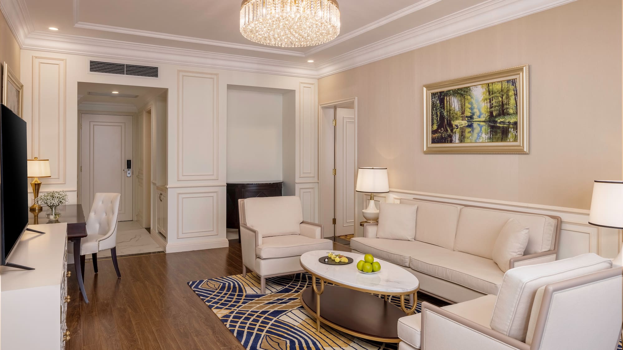 a living room with a chandelier and couches