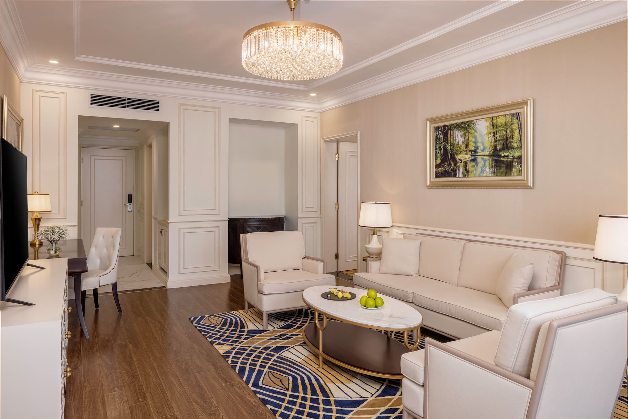 a living room with a chandelier and couches