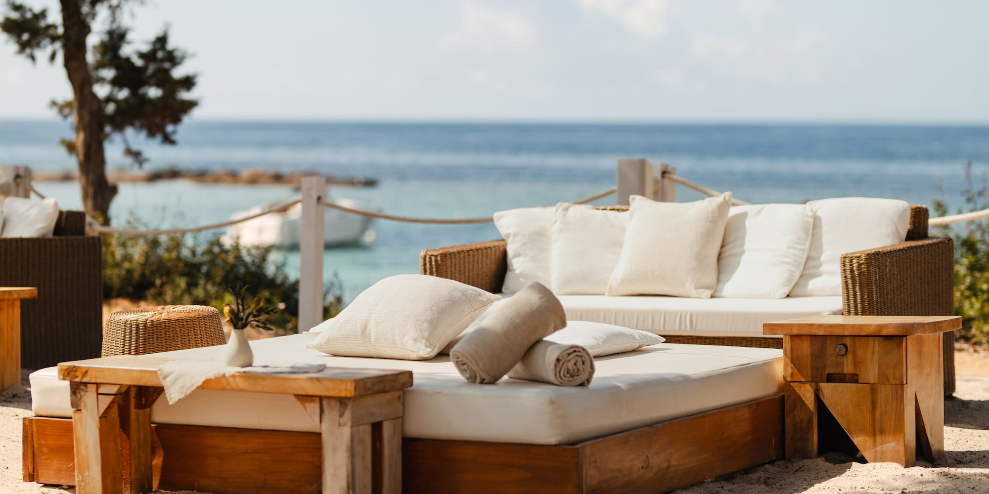 a couches and chairs on a beach