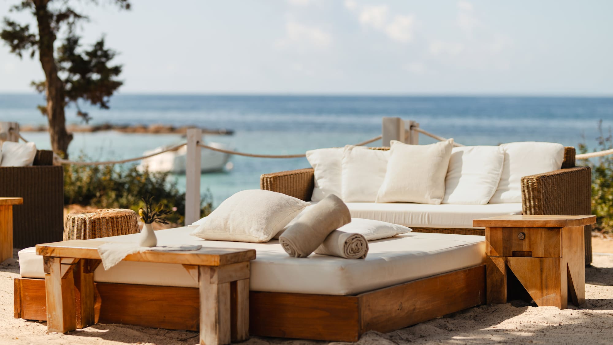 a couches and chairs on a beach