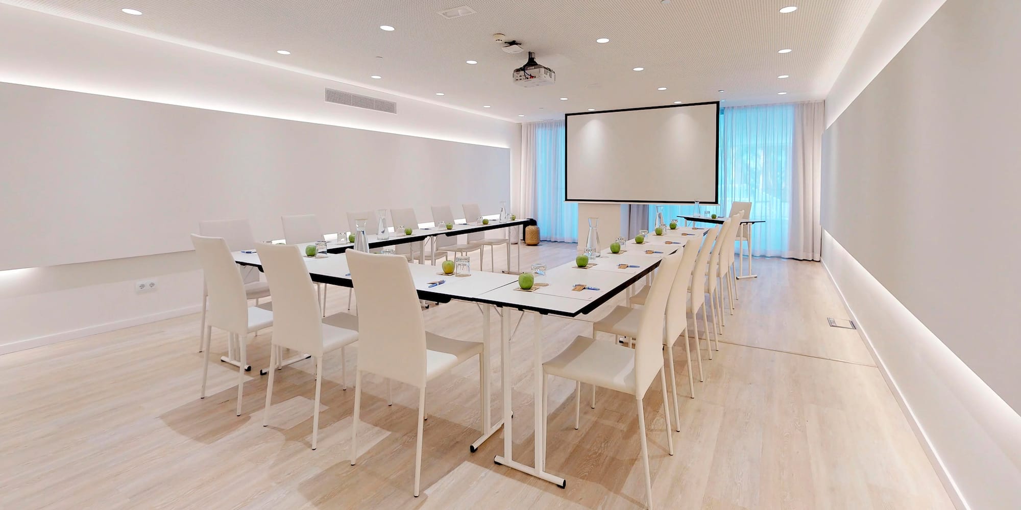 a room with a large table and chairs