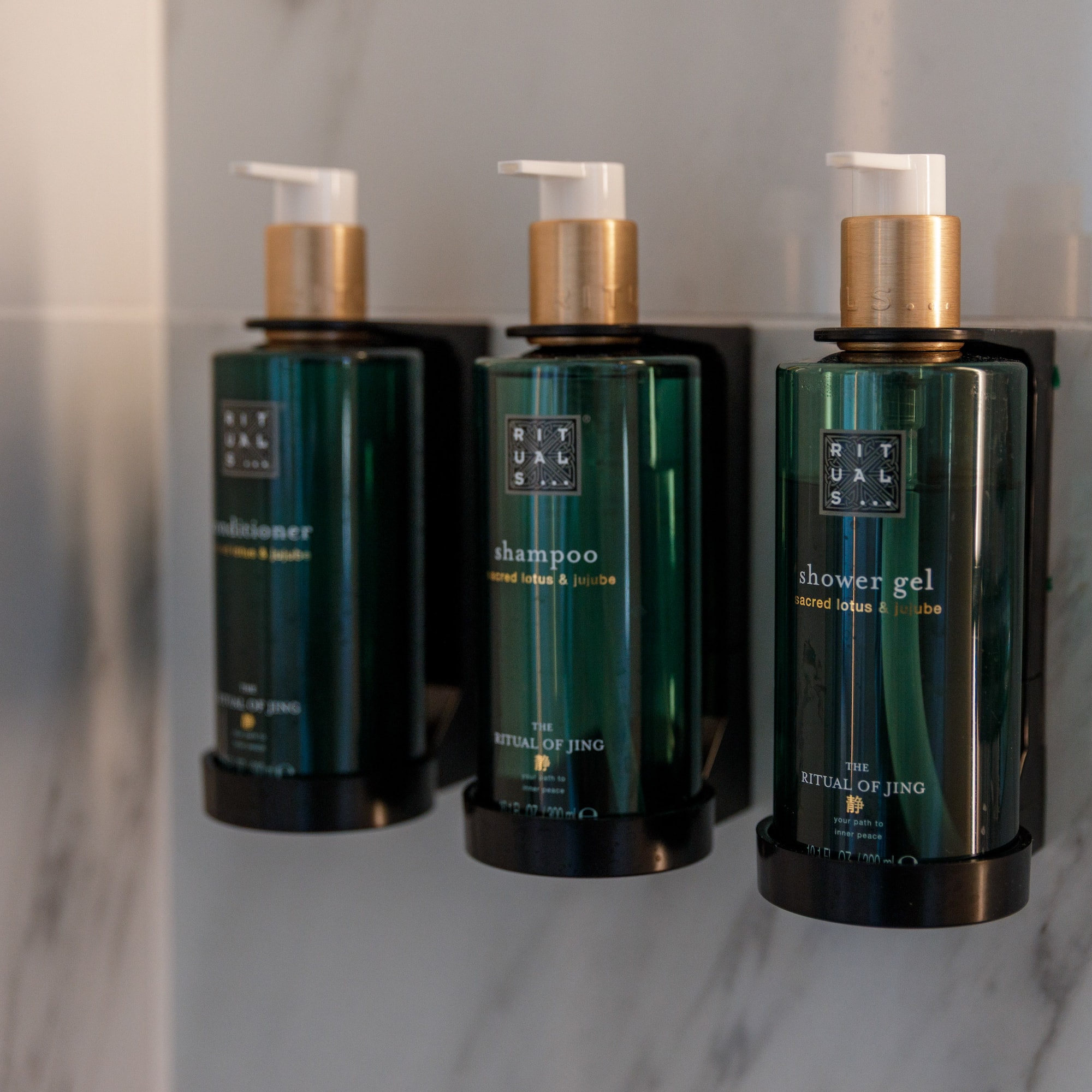 a group of bottles of shampoo and shower gel