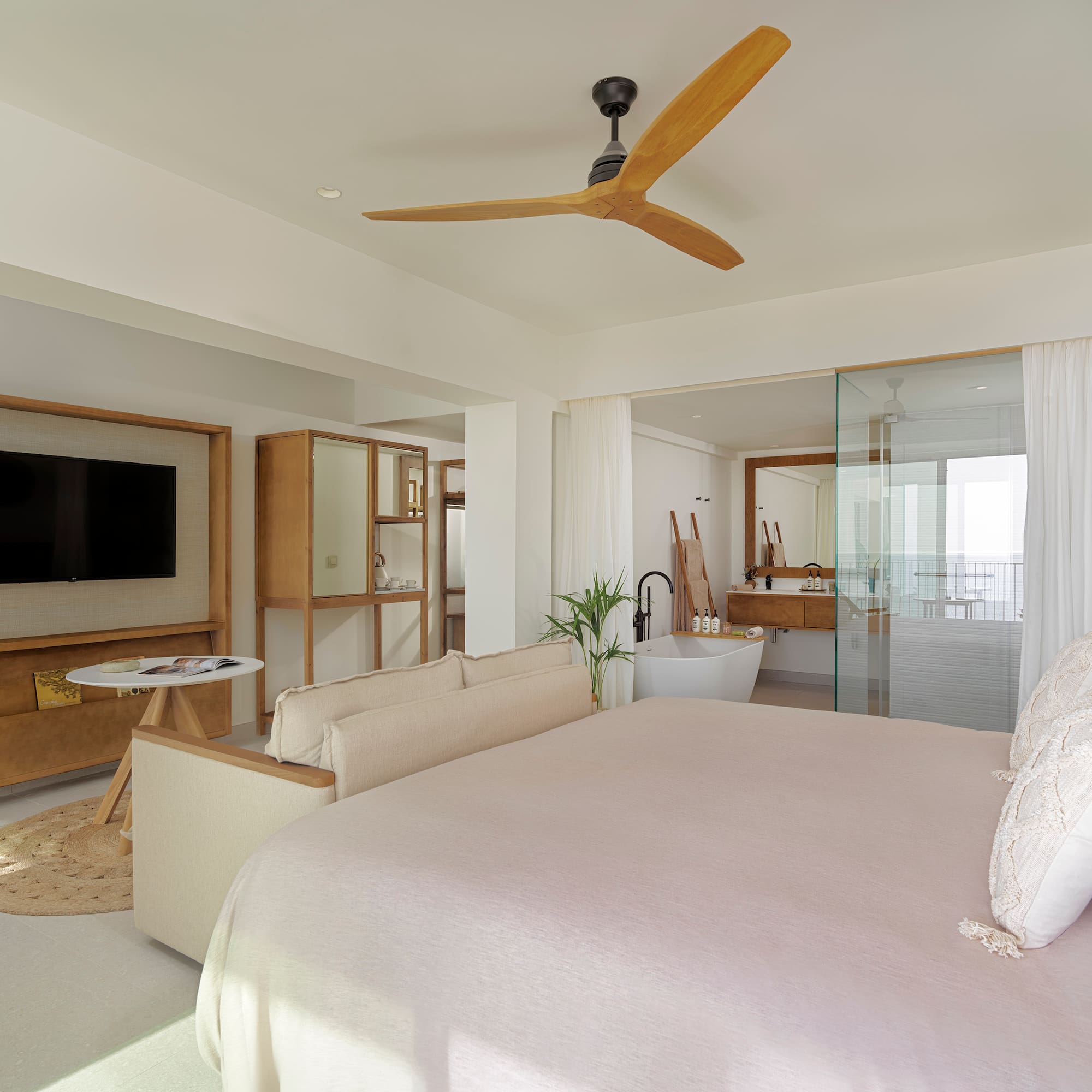 a bedroom with a large bed and a television