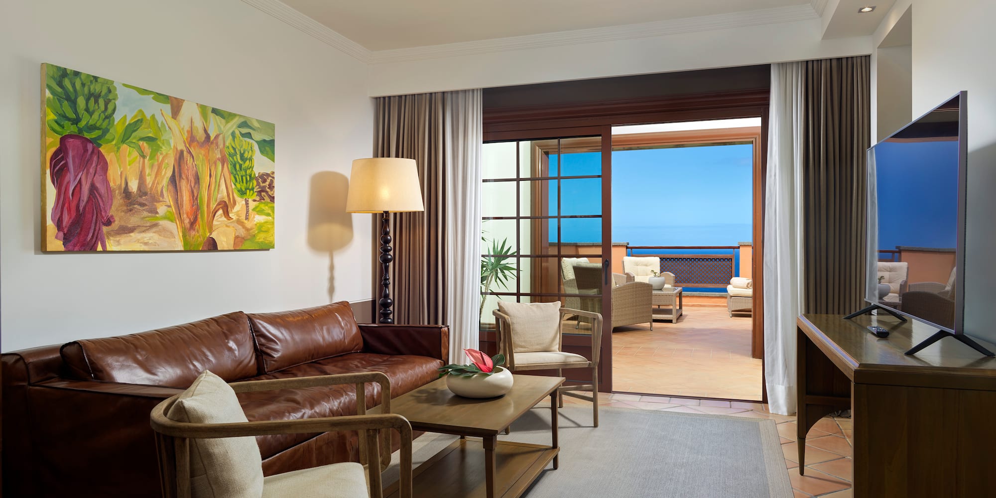 a living room with a couch and a television