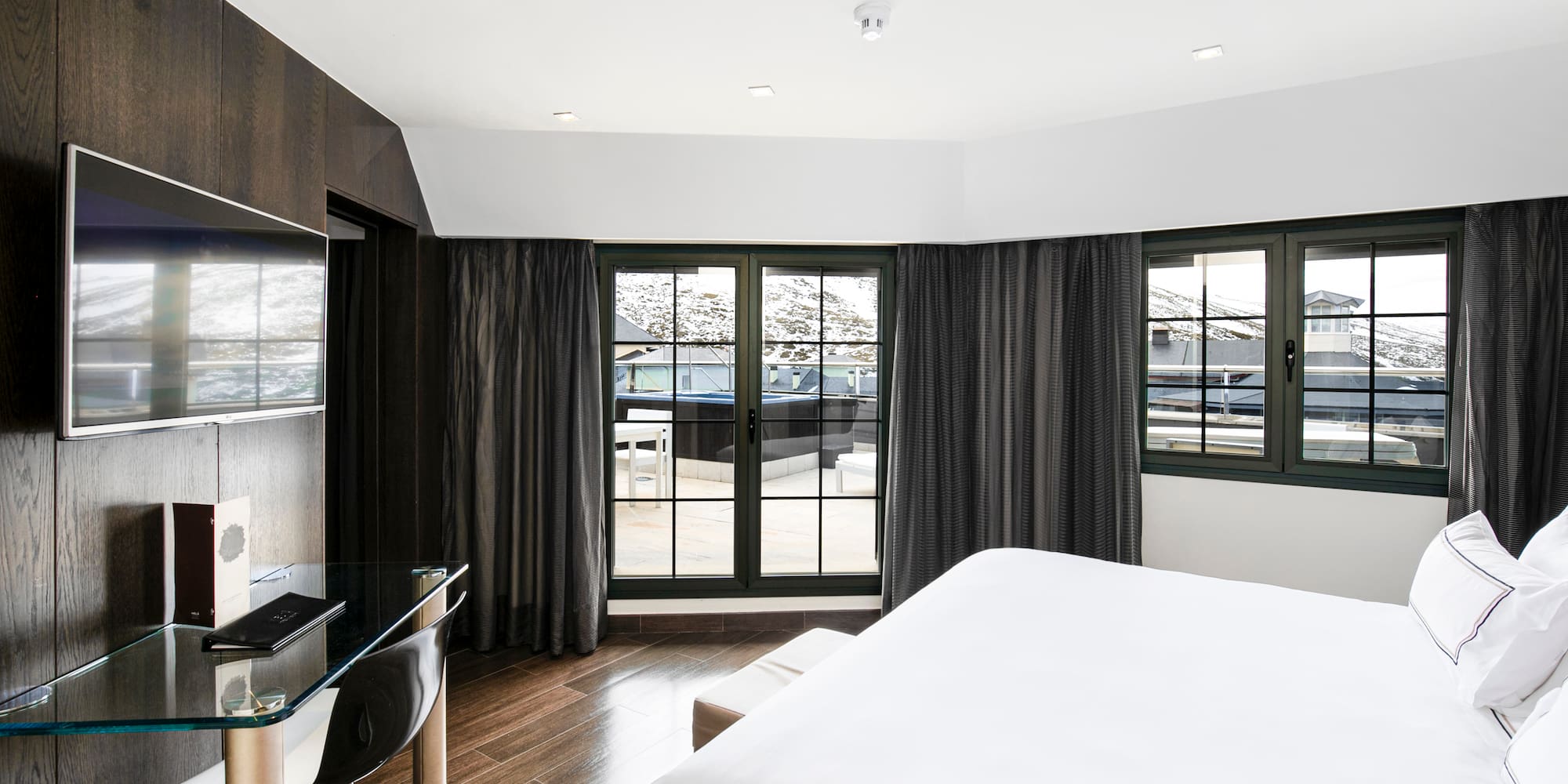 a room with a bed and a desk