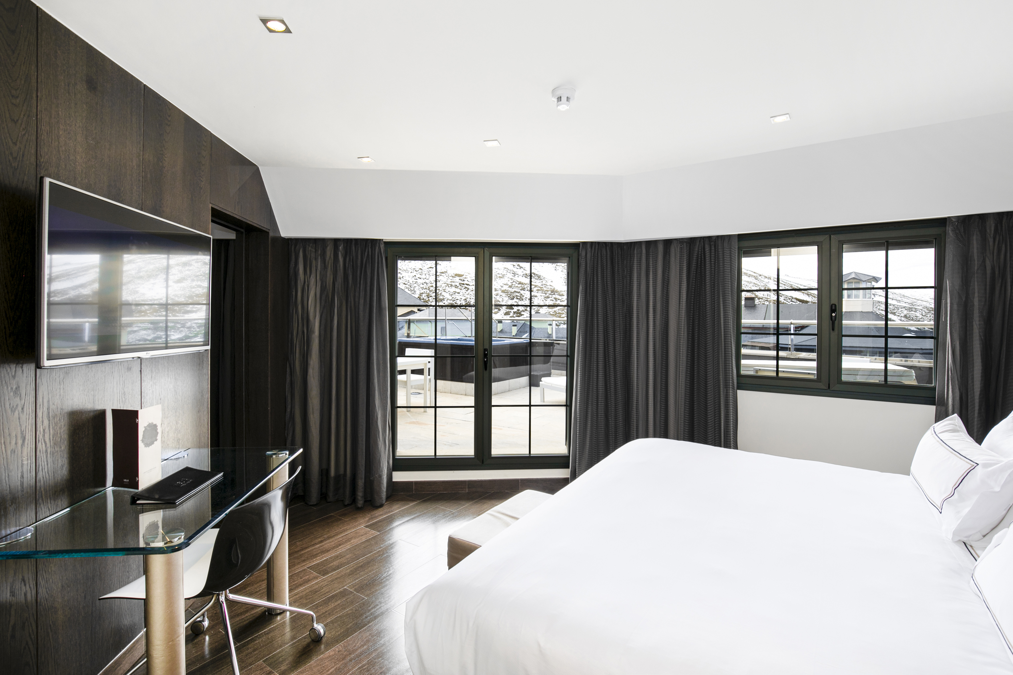 a room with a bed and a desk