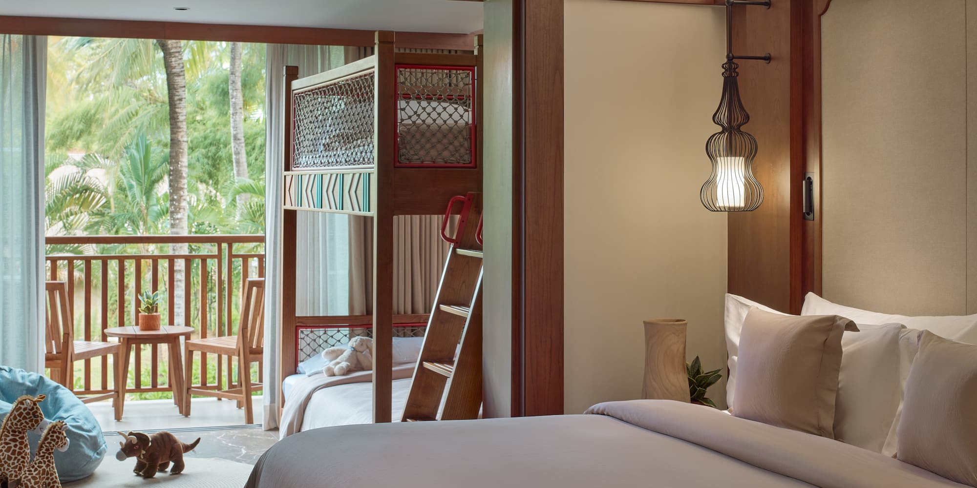 a room with a bed and bunk beds