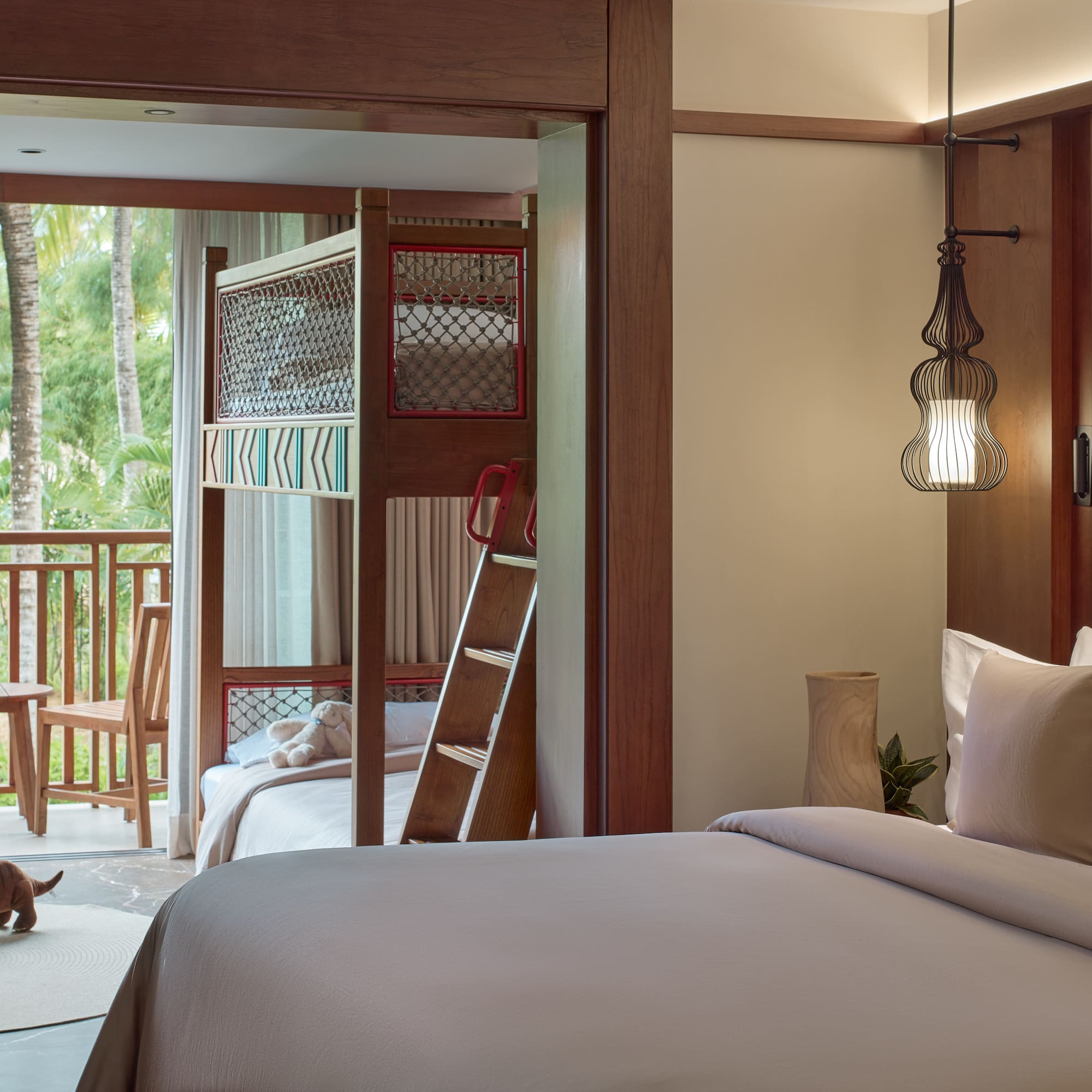 a room with a bed and bunk beds