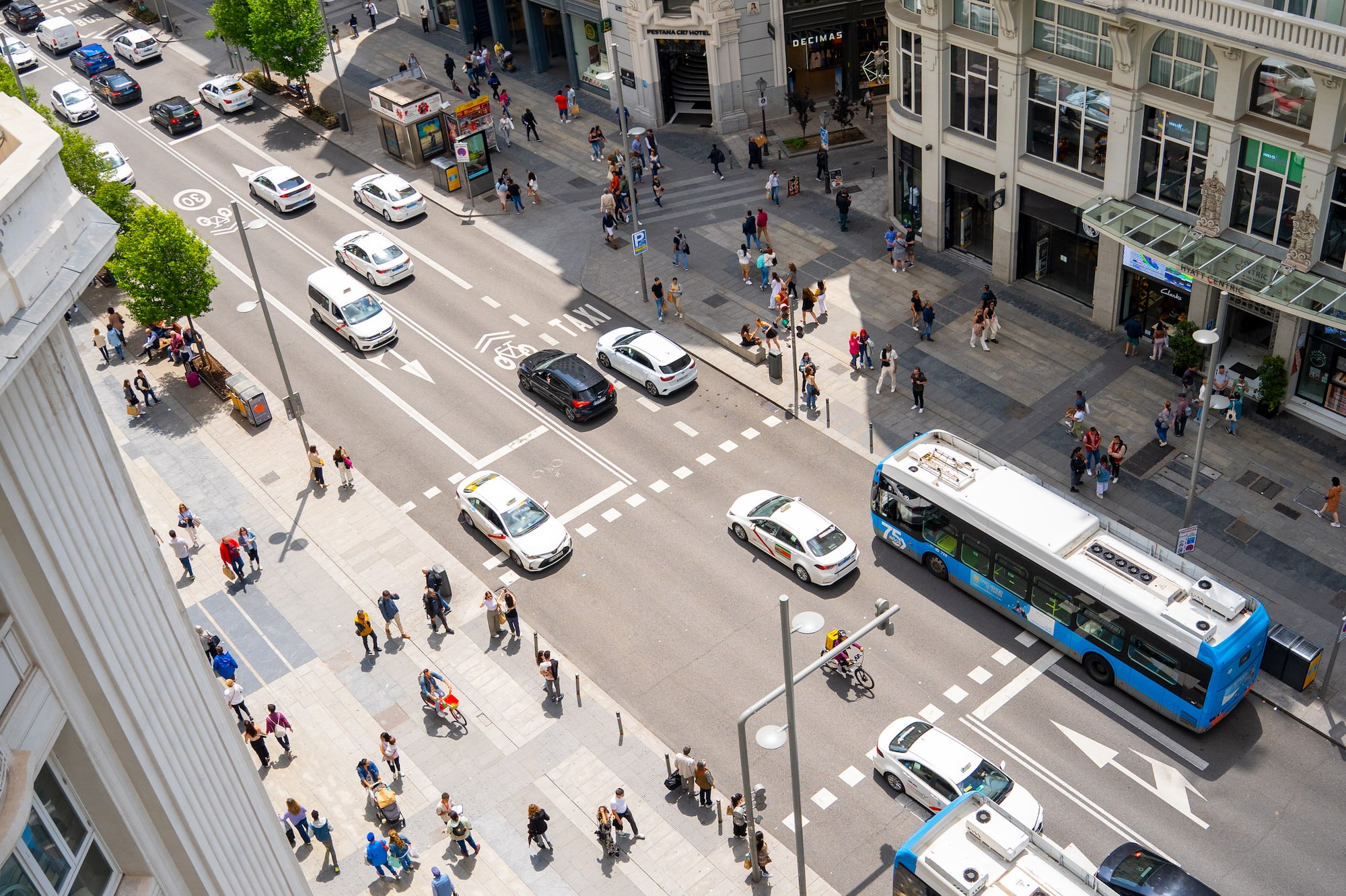 a city street with people and cars