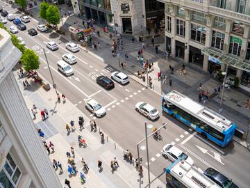 a city street with people and cars