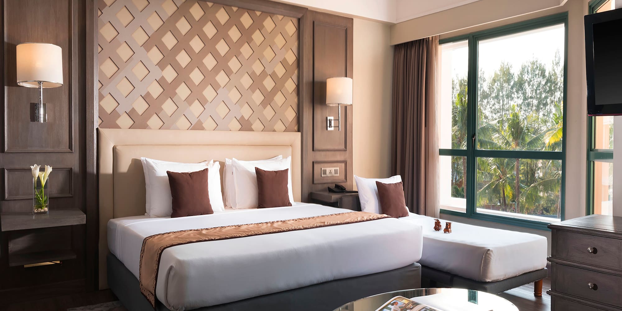 a bedroom with a bed and a glass table