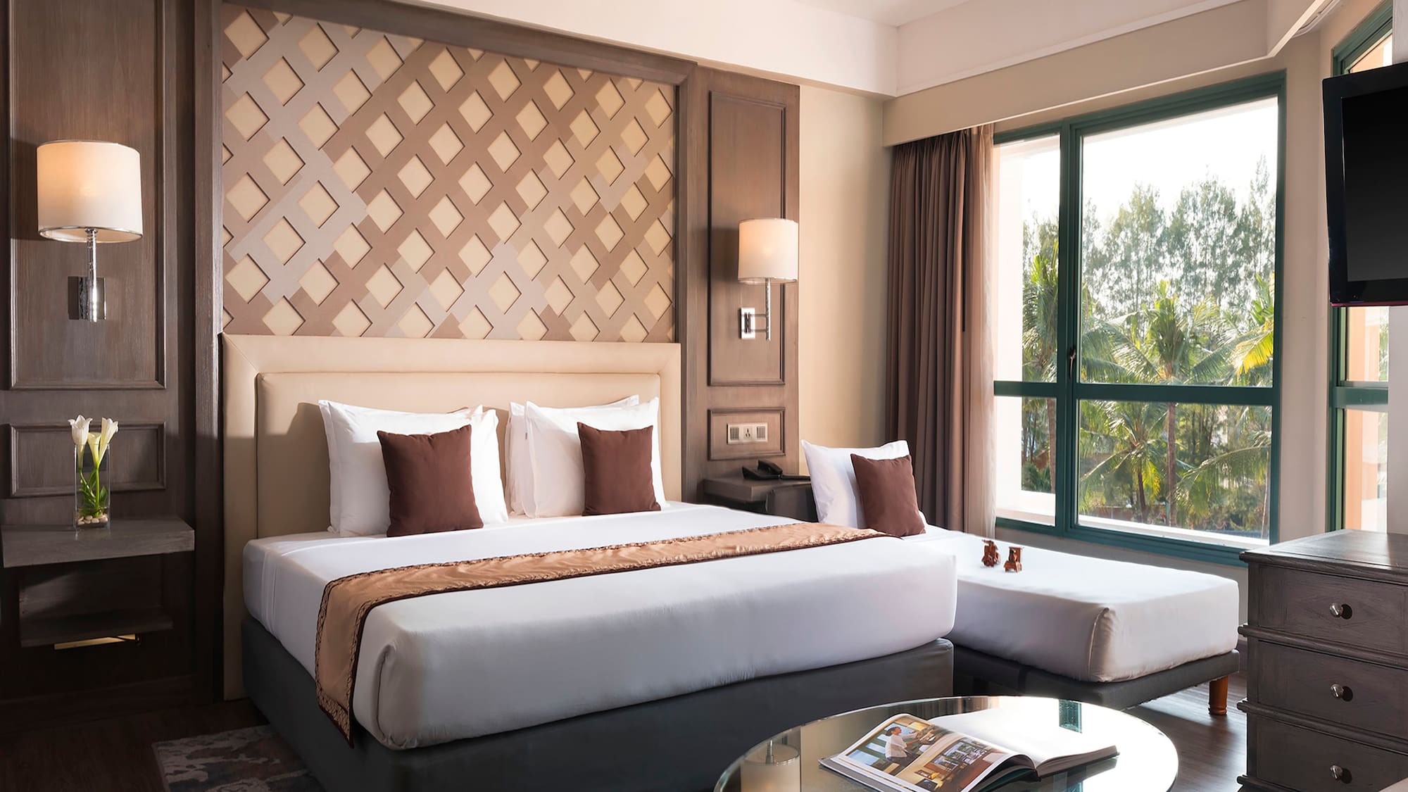 a bedroom with a bed and a glass table