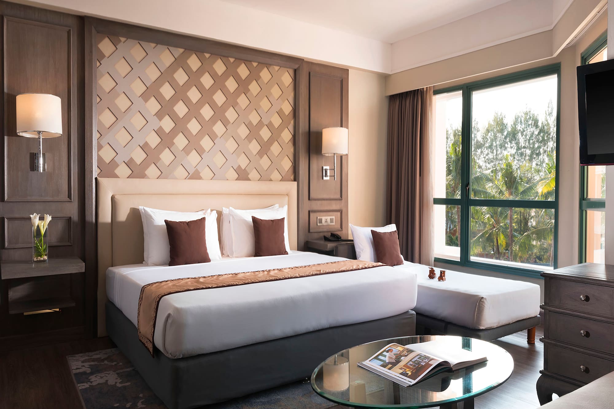 a bedroom with a bed and a glass table